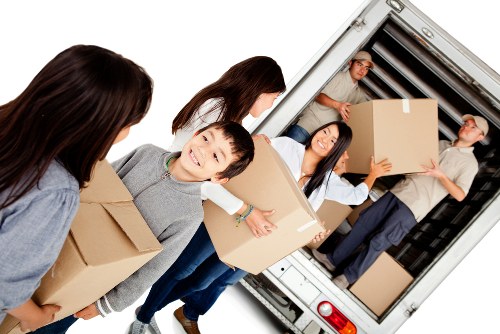 Mover handling boxes safely during a Barking van move