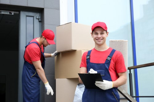 Trained mover securing furniture inside a van