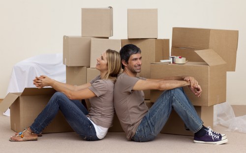 Loading furniture into a removals van in Barking