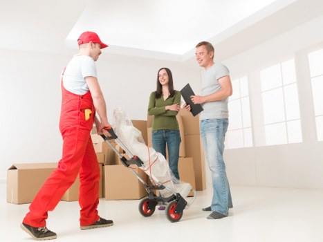 Local removal team handling furniture in East London