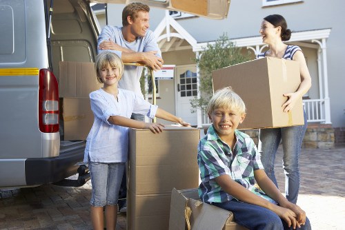 Packing and loading belongings into a moving truck in Barking
