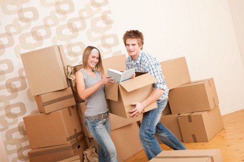 Packed moving boxes and household items ready for removal in Barking