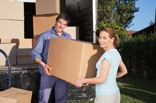 Team member explaining public liability insurance coverage for moving services